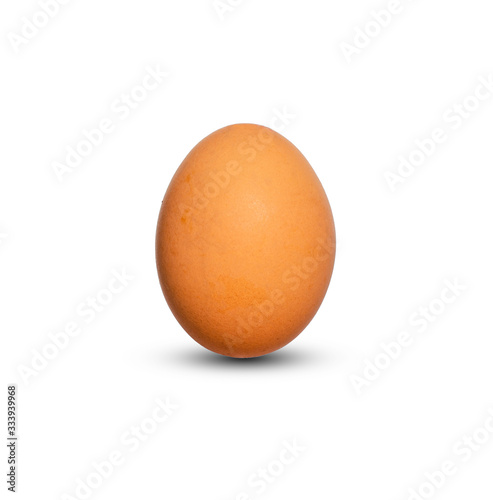 single chicken egg beautiful standing on white isolated background with clipping path and reflection. raw ingredient object.