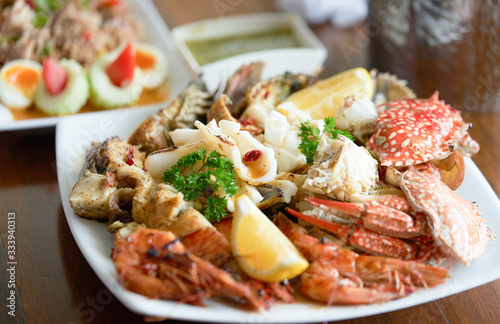 seafood on plate with spocy tasty dipping sauce