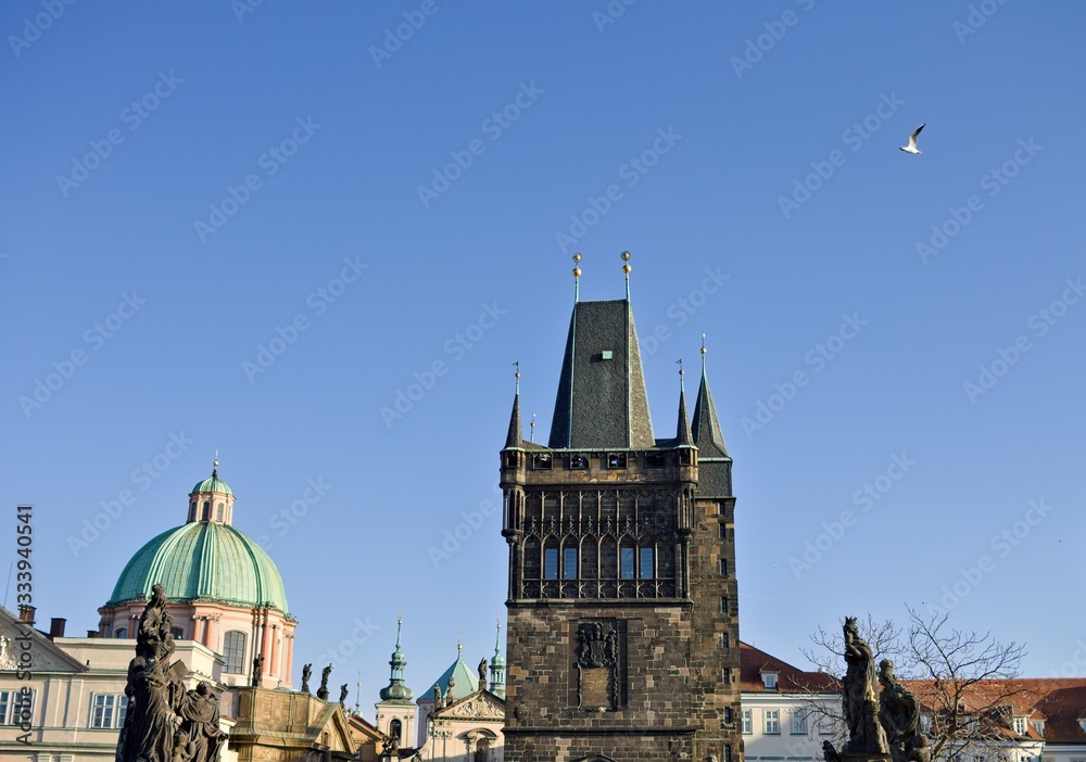 Fototapeta premium View of the Charles Bridge Tower and the statues on the Charles Bridge (Prague, Czech Republic, Europe)