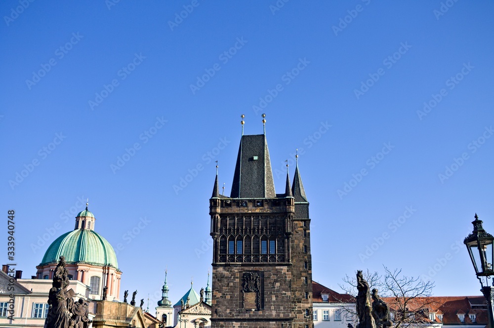 Fototapeta premium View of the Charles Bridge Tower and the statues on the Charles Bridge (Prague, Czech Republic, Europe)