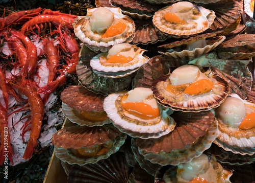 Coquille St Jacques on sale at the Bastille weekend market, Paris, France