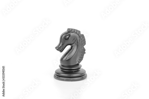 Black chess piece horse isolated on a white background. The concept of board games  logic  training for the brain.