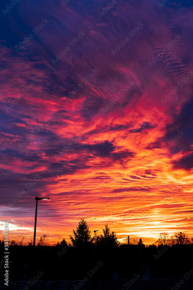 Colorful sky at sunset. Dramatic fiery sunset sky
