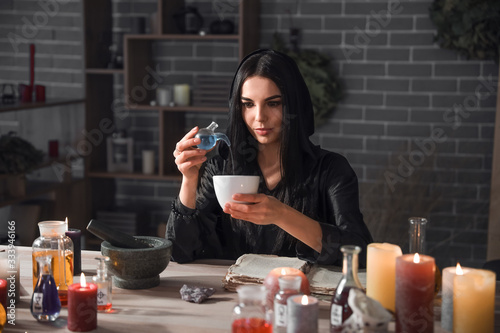 Female alchemist making eli...