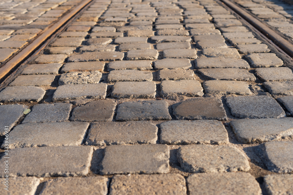 Fototapeta premium Street made of cobblestone. Granite cubes.