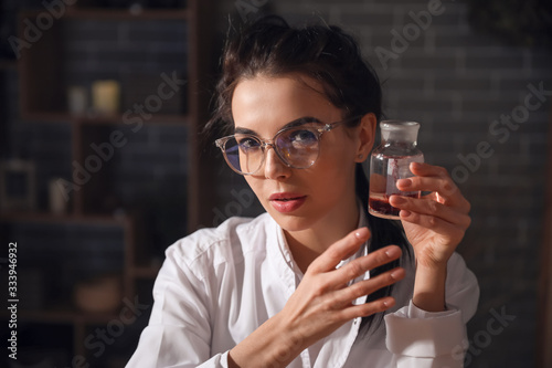 Female alchemist with potio...