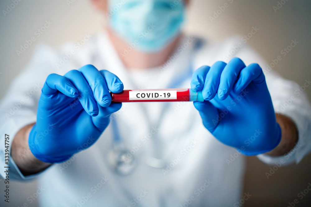 Coronavirus in Lab. Scientist hold Blood Test. New Epidemic Coronavirus 2019 nCoV. Background with copy space. Coronavirus in Lab. Scientist hold Blood Test. New Epidemic Coronavirus 2019 nCoV. Background with copy space.