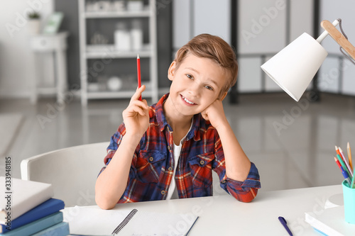 Little boy doing lessons at...