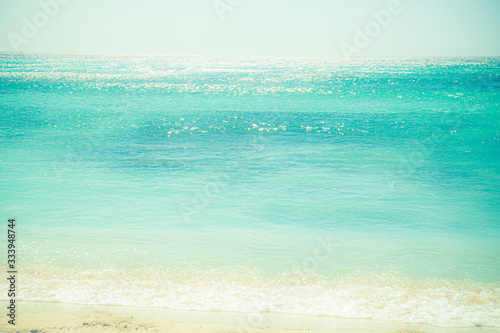 beautiful ocean with shoreline, sand and sunlight