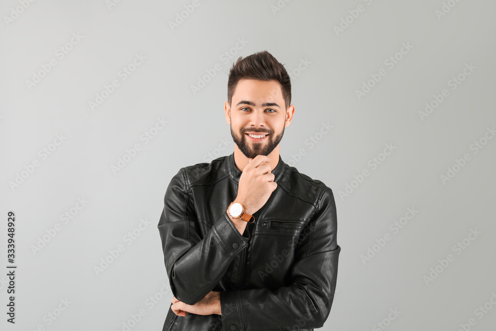 Handsome man with healthy hair on light background Handsome man with healthy hair on light background