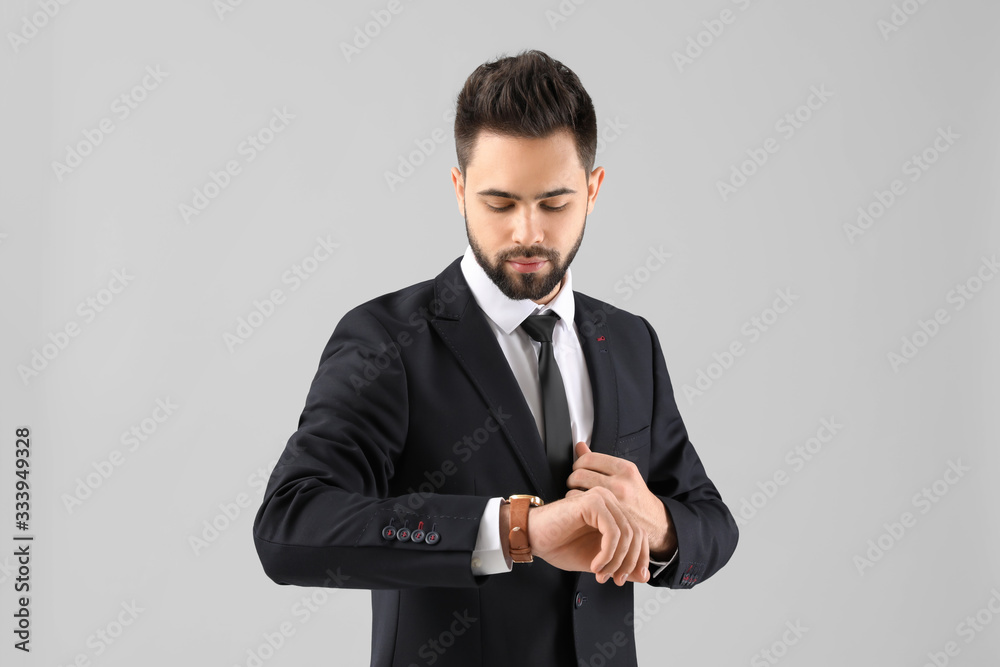 Handsome businessman with healthy hair on light background Handsome businessman with healthy hair on light background