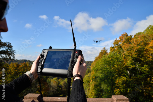 black flying drone in sky