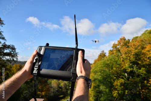 black flying drone in sky