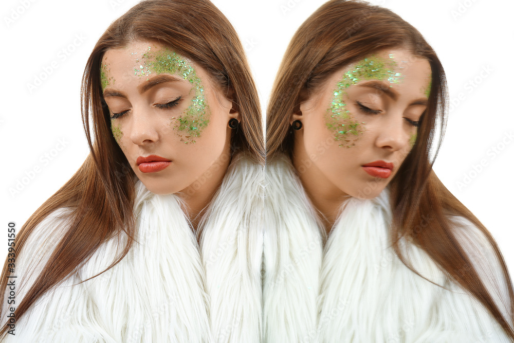 Fashionable young woman with glitters on body and her mirror reflection against white background Fashionable young woman with glitters on body and her mirror reflection against white background