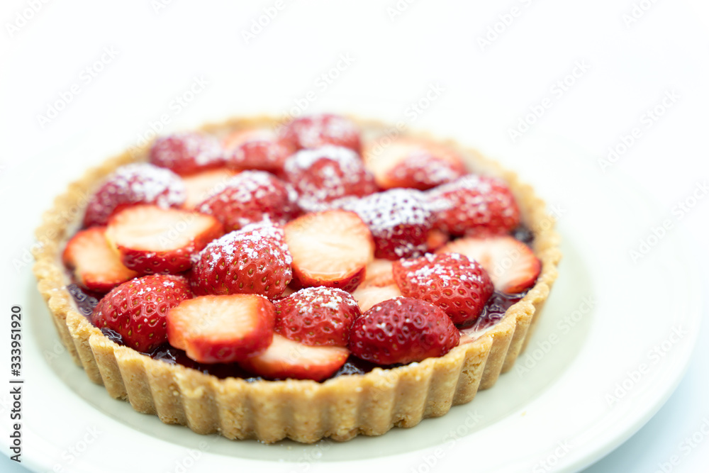 Strawberry tart shot in studio on white background Strawberry tart shot in studio on white background