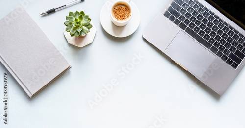 Tableau sur toile flat lay composition with laptop, pen, coffee, notebook on grey background banner