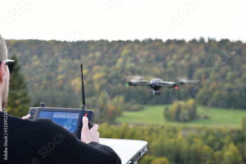 black flying drone in sky