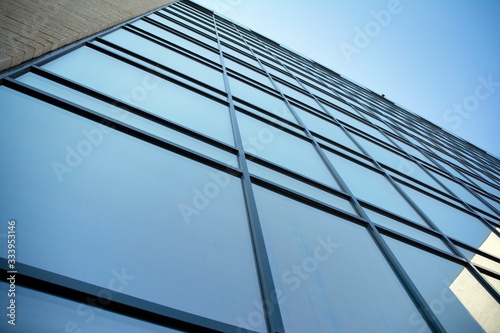 Abstract texture and blue glass facade in modern office building. 