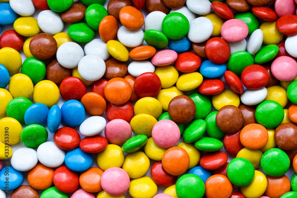 Background of sweets, chocolates of different colors Background of sweets, chocolates of different colors