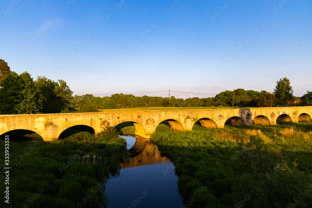 Old stone bridge over Vitek pond near Trebon, Southern Bohemia, Czech Republic