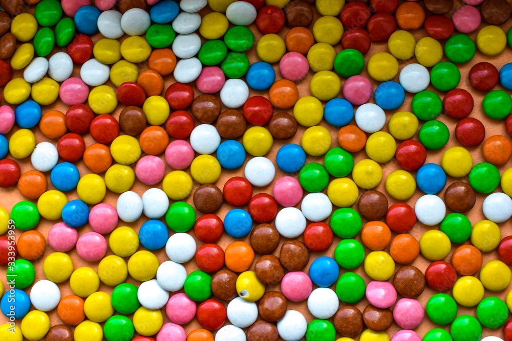 Background of sweets, chocolates of different colors Background of sweets, chocolates of different colors