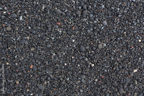 A background of black vulcanic sand