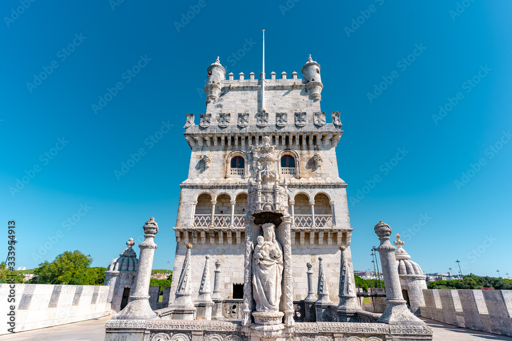 16th century statue of Saint Mary holding Jesus at Belem Tower, Lisbon, Portugal