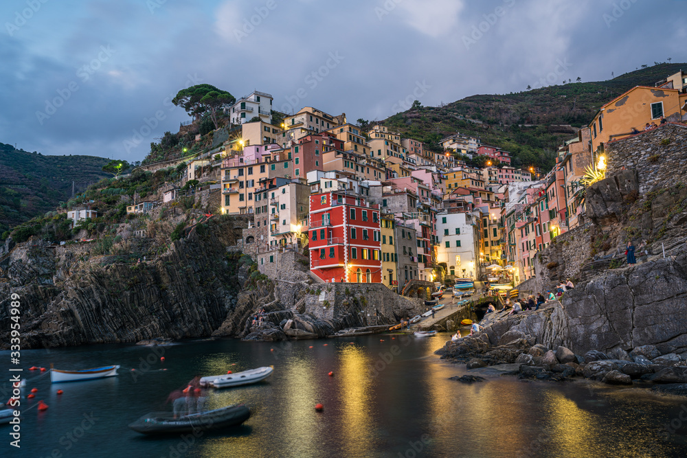 Riomaggiore town on Italian coastline at sunset in Cinque Terre, Italy