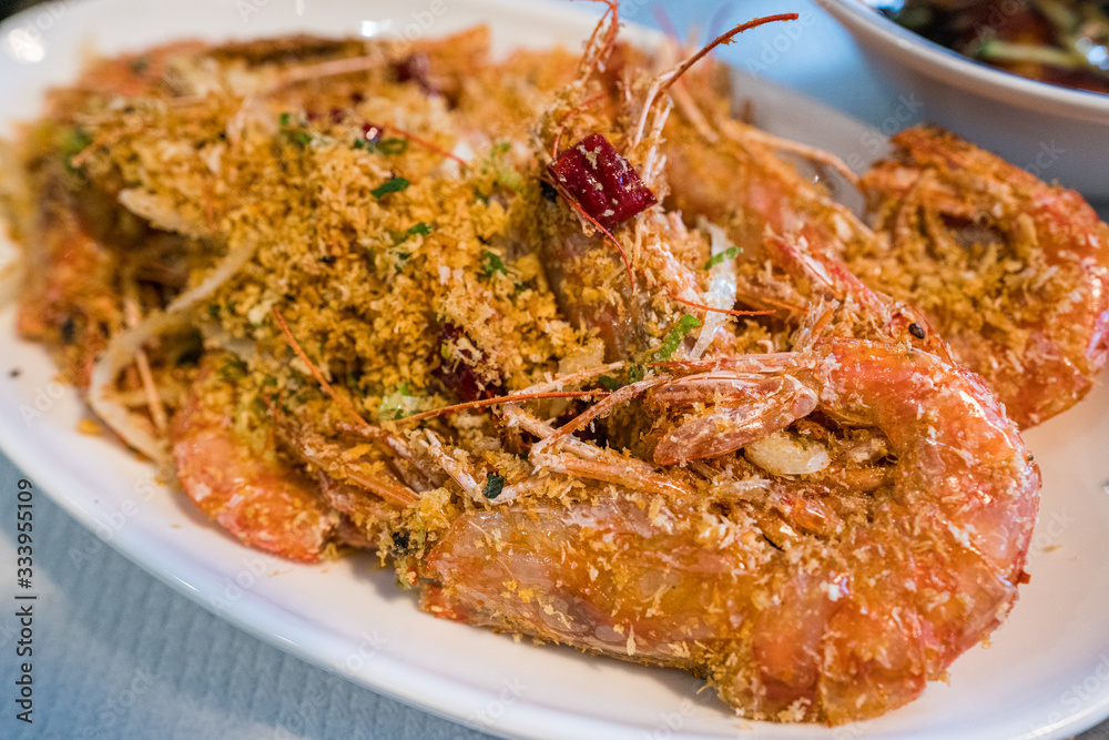 Deep fried crispy shrimp with salt and garlic - close up Deep fried crispy shrimp with salt and garlic - close up