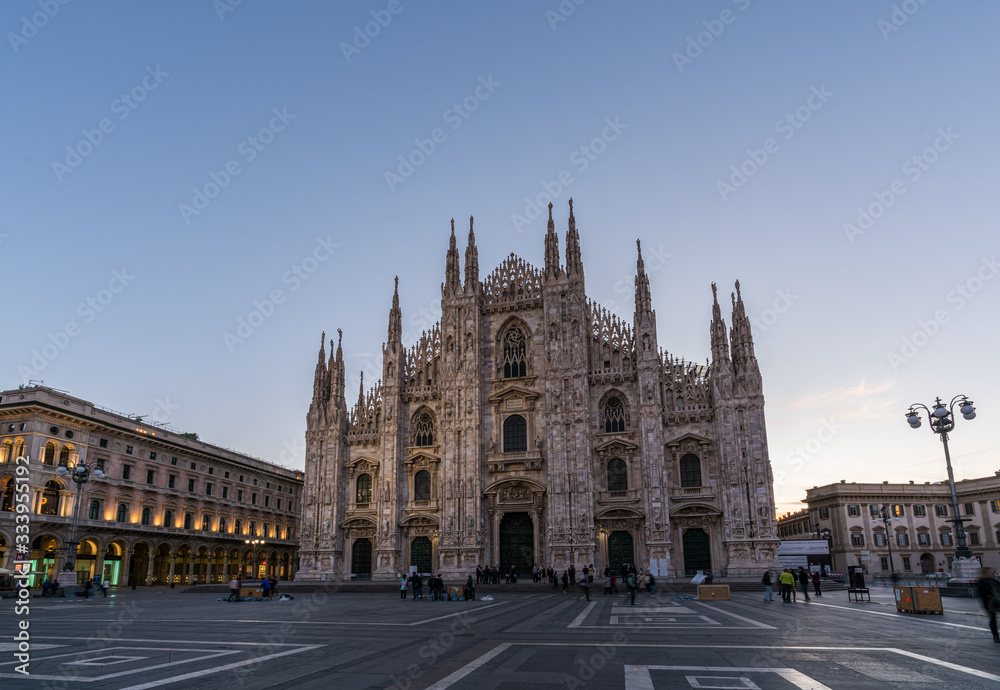  Duomo di Milan , the most famous gothic white marble cathedral church of Milan, in the morning, Italy.