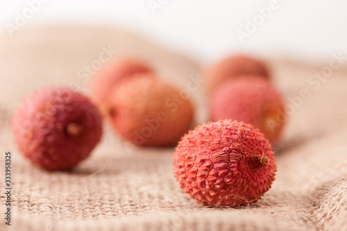 Lychee fruits on sackcloth photo