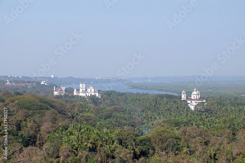Old Goa along Mandovi River with Se Cathedral in front of Church of St Francis of Assisi, left, and Church of St Cajetan, right, Goa, India
