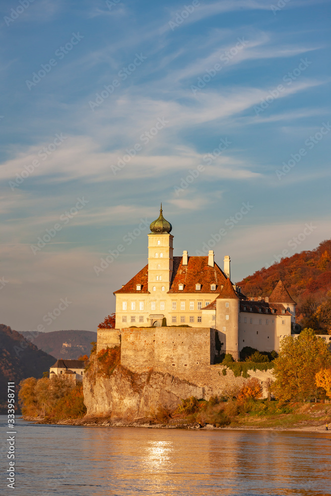 Small castle Schonbuhel above the Danube in the romantic sunset, Austria