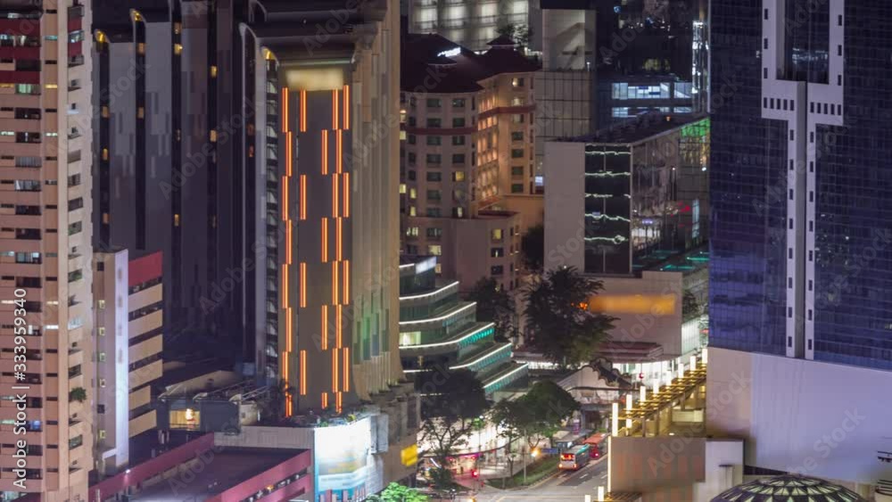 Aerial cityscape of Singapore downtown of modern architecture with skyscrapers night timelapse, view from skybridge viewpoint with traffic on Eu Tong Sen Street and new bridge road