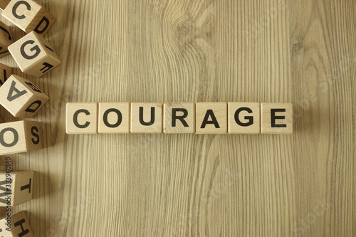 Fototapete Word courage from wooden blocks