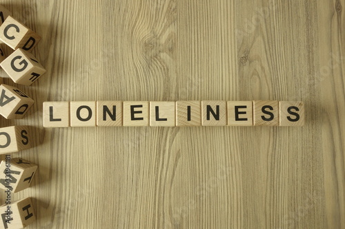 Word loneliness from wooden blocks