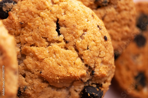 Cookie with chocolate chip with selective focus  close-up. Macro sweet baked food  texture
