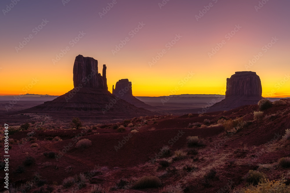 Beautiful colorful sunrise view of famous Buttes of Monument Valley on the border between Arizona and Utah, USA