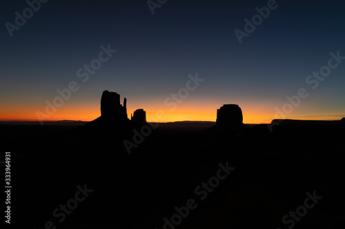 Silhouette photo of famous Buttes at the first rays of dawn light of Monument Valley on the border between Arizona and Utah  USA