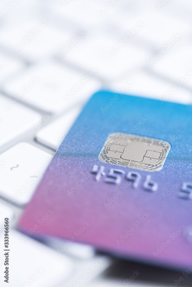 Finance. Security. Bank card laying on a white keyboard. Money security Finance. Security. Bank card laying on a white keyboard. Money security