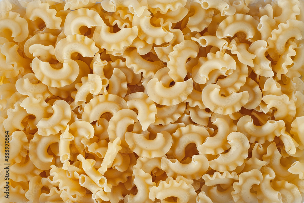 Pasta texture. Many yellow pasta are piled on the pile. Pasta texture. Many yellow pasta are piled on the pile.