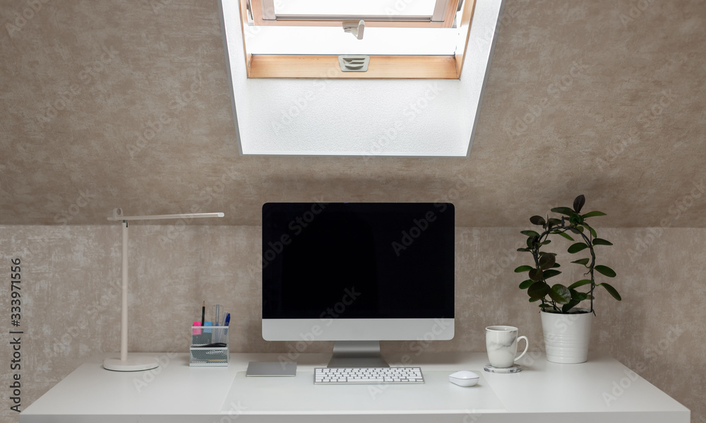 office desk with monitor, table lamp and coffee mug. working home. coffee break. horizontal image. selective focus office desk with monitor, table lamp and coffee mug. working home. coffee break. horizontal image. selective focus