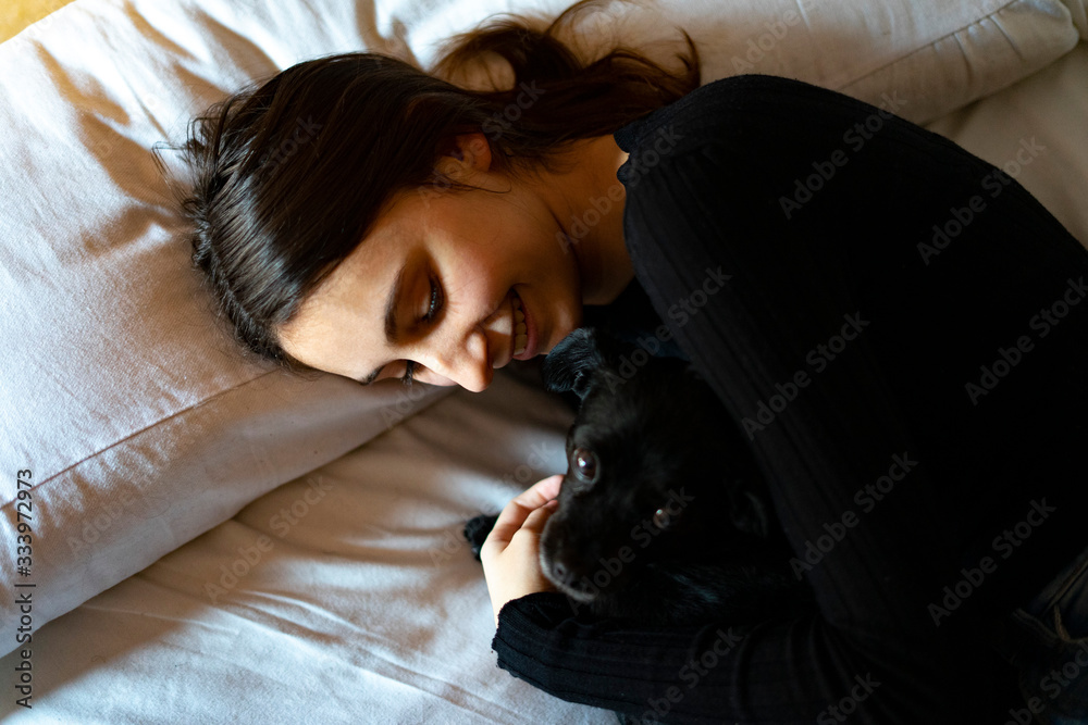 Woman sleeping with a dog. Woman sleeping with a dog.