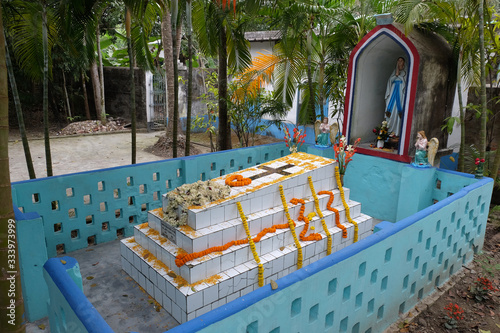 The tomb of a Croatian missionary, Jesuit father Ante Gabric, decorated on the occasion of his 105th birthday in Kumrokhali, West Bengal, India photo