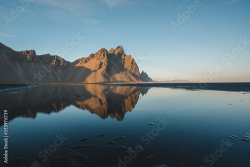 Sunset along the coastline of South Iceland with Beautiful Mountains and Reflection of Landscape © Ernest