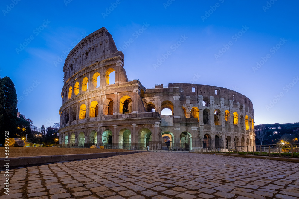 ROMA, ITALY – 29 March 2020: Sunset, view of Coliseum. Nobody for coronavirus pandemic, Italy in lockdown