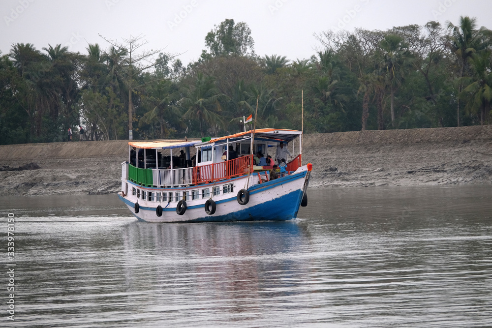 Tourist boats starting their sightseeing trips in Sundarbans, West Bengal, India Tourist boats starting their sightseeing trips in Sundarbans, West Bengal, India