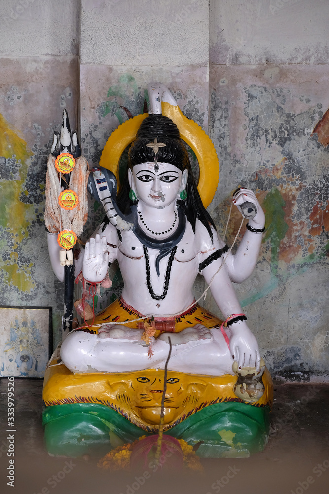 Fototapeta premium Statue of Lord Shiva in Hindu temple in Sambhunagar village, West Bengal, India