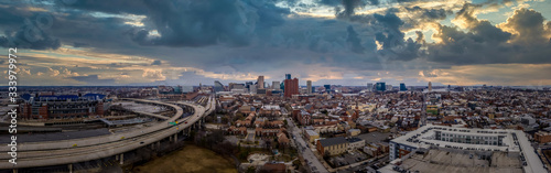Aerial panorama of Baltimore downtown with I-395 highway, Sharp Leadenhall, Riverside, Otterbein, Federal Hill neighborhoods with dramatic sunset sky in Maryland United States photo