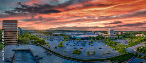 Aerial sunset view of Columbia town center in Howard Country Maryland with dramatic red, orange, blue, purple colors over the office and residential buildings photo